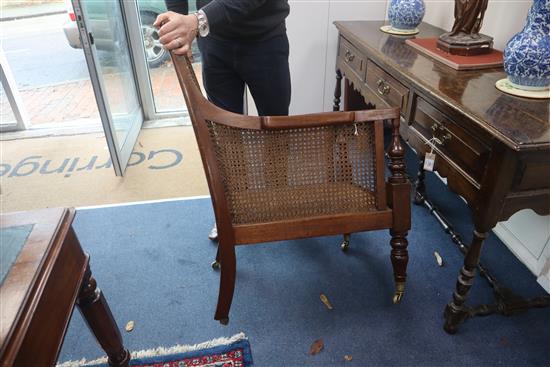 A George III mahogany Bergere with leather squab